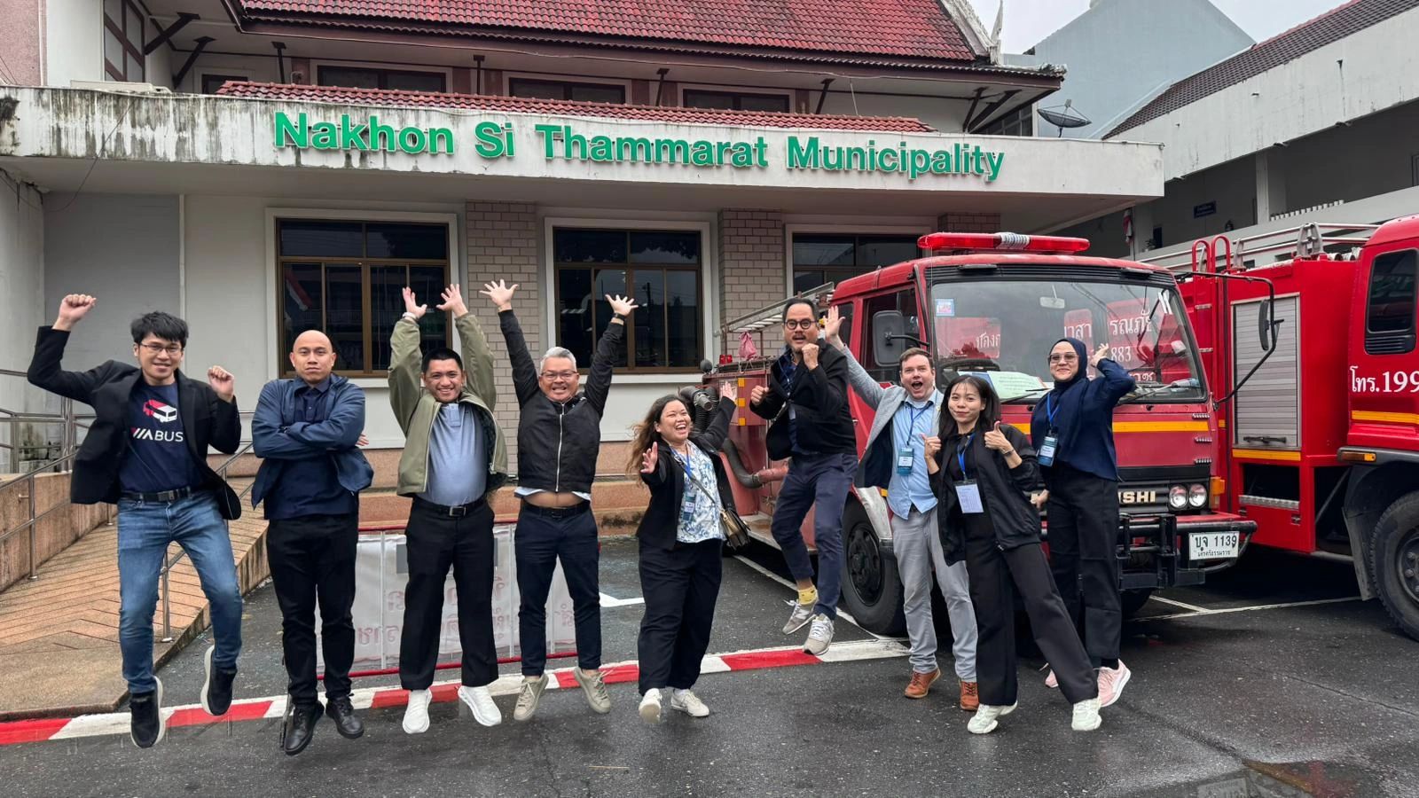 ASEAN CSCO Workshop group jumping in front of Nakhon Si Thammarat Municipality